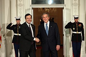 President George W. Bush greets Bank of Italy Governor and Financial Stability Forum Chairman Mario Draghi