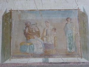 VIII.1.a, Pompeii. June 2017. Painted panel from west end of south wall of enthroned Pindar with lyre, with Muse and poetess