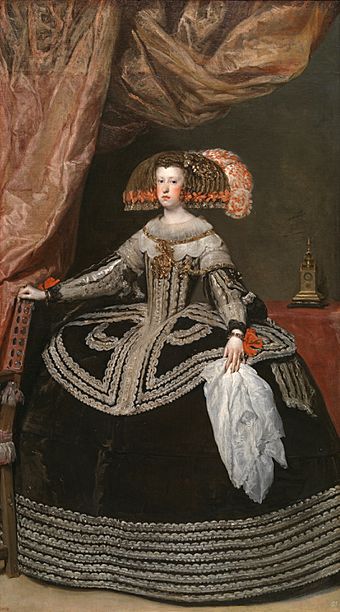 A young lady is shown standing in a black dress with a wide farthingale.