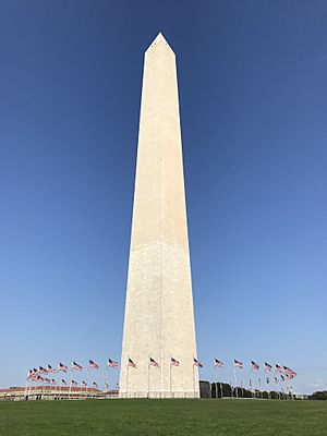 Washington Monument with American flags on a gorgeous Fall day.jpg