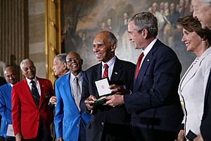 President George W. Bush Presents the Congressional Gold Medal to Dr. Roscoe Brown Jr., During Ceremonies Honoring the Tuskegee Airmen at the U.S. Capitol