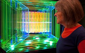 Dorothy Tanner looking at the light sculpture, Logo, by Dorothy and Mel Tanner.jpg
