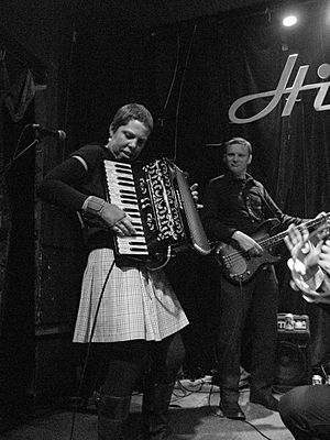 Jenny Conlee playing accordion with KMRIA