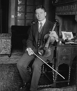man holding violin