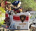 Wilma & Wilber Wildcat in the bucket of Tucson Fire Department ladder truck 1