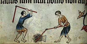 Two men threshing sheaf - Luttrell Psalter (c.1325-1335), f.74v - BL Add MS 42130