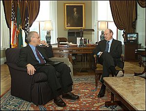 Chernow (left) with former U.S. Treasury Secretary John W. Snow in September 2004