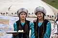 Kyrgyz women offering butter and salt