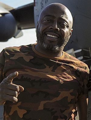 Donnell Rawlings stands in front of a C-17 Globemaster III (32666816002) (cropped).jpg