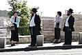 Haredi (Orthodox) Jewish Couples at Bus Stop - Outside Old City - Jerusalem (5684561290)