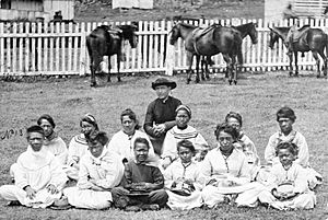 Father Damien with the Kalawao Girls Choir, at Kalaupapa, Molokai, circa 1878