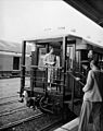 Queen Elizabeth II standing on platform of her railway carriage at Masterton. PHOTOGRAPHER J.F. Le Cren DATE 15 January 1954 (cropped)