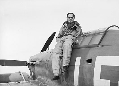 Squadron Leader Douglas Bader, CO of No. 242 Squadron, seated on his Hawker Hurricane at Duxford, September 1940. CH1406