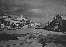 Fourth Avenue, which emerged as the early town's main east-west street, as it appeared in 1944 (left) and 1953 (right), both views looking east towards the Fourth Avenue Theatre and the Federal Building.