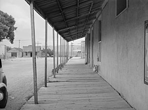 Covered board sidewalk in Tombstone, Arizona - May 1940