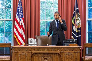 U.S. President Barack Obama talks on the telephone with Oklahoma Governor Mary Fallin following the 2013 Moore tornado