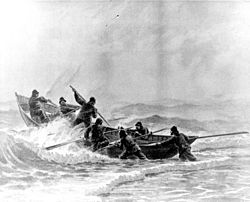 A Life-Saving crew launches a surfboat through heavy surf. Courtesy of U.S. Coast Guard Historian’s office