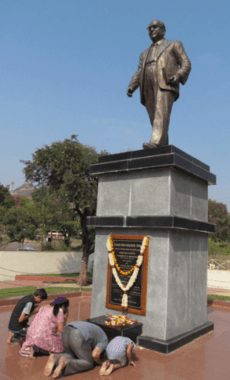 People paying tribute at the central statue of Bodhisattva Babasaheb Ambedkar in Dr. Babasaheb Ambedkar Marathwada University, India