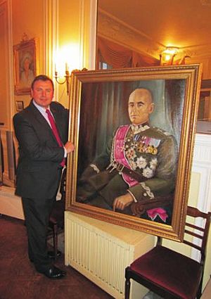 Philip Bujak with the restored painting of Polish Marshal Rydz-Smigly restored for the Sikorski Institute, London