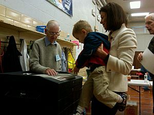 Ayotte's son, Jake, helps her cast her ballot