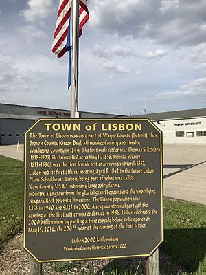 Historical sign outside the fire and highway departments detailing Lisbon town history