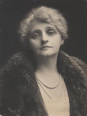 Black and white portrait photograph of Margaret Moir taken around 1900. She is looking into the camera, wearing a dress, a coat and a necklace.