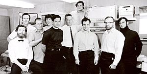 Ten computer engineers pose for a 1969 black-and-white photo