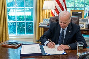 President Joe Biden signs the bipartisan budget agreement into law