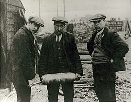 Three men with shell (5634004381)