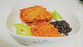 Chicken Enchiladas with red sauce, red rice, black beans, and avocado
