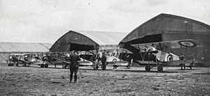 Lineup of RNAS Nieuport 11s, with a Nieuport 10 closest to the camera at their airfield at Dunkirk in February 1915 (cropped)