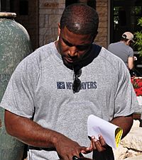 Priest Holmes speaks with soldiers CROPPED