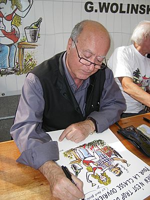 G. Wolinski dédicaçant à la fête de l'Huma 2007-02.JPG