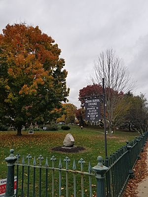 Indian Burial Ground in Natick MA with iron fence and plaque stating that the burial ground was granted to Oliver Peabody in the year of 1731