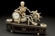 Alarm clock, mounted on model of coffin