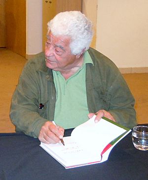 Antonio Carluccio signing books.jpg