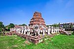 Ruins of Chedi Singha Lom Wat Thammikarat.jpg