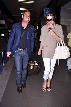 Shane Warne with, Liz Hurley snapped at the airport (5)