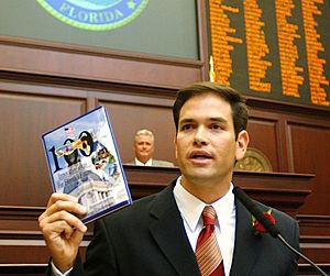Speaker-designate Marco Rubio with a blank book titled 100 Innovative Ideas For Florida's Future